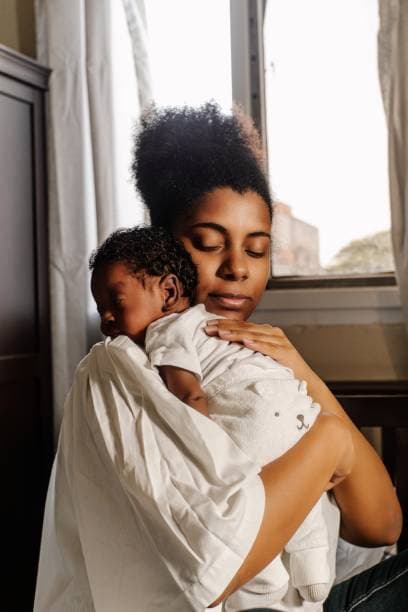 Mother caring for her newborn baby